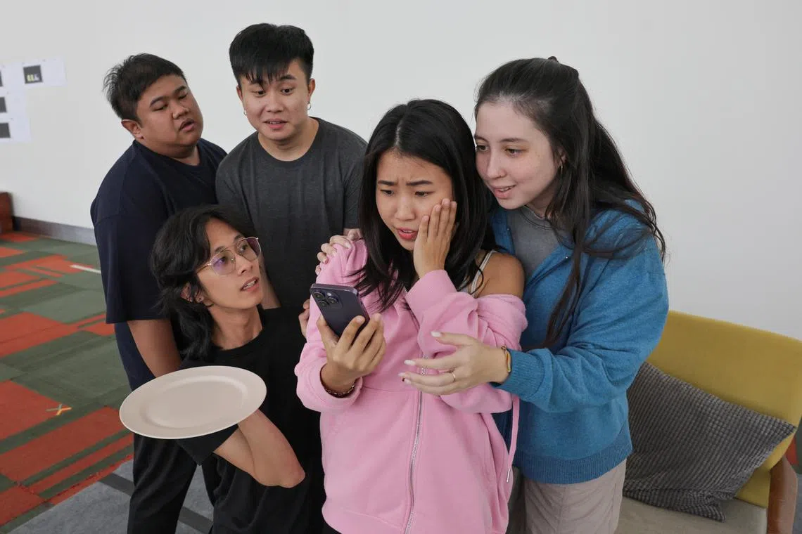 (Clockwise from left): Izzul Irfan, 25; Chaney Chia, 27; Janine Ng, 20; Kyra Lefebvre, 20; and Matthias Teh, 25; in a rehearsal for Checkpoint Theatre's new play, Hard Mode at Drama Centre Visitors Centre, on Sep 18, 2024.