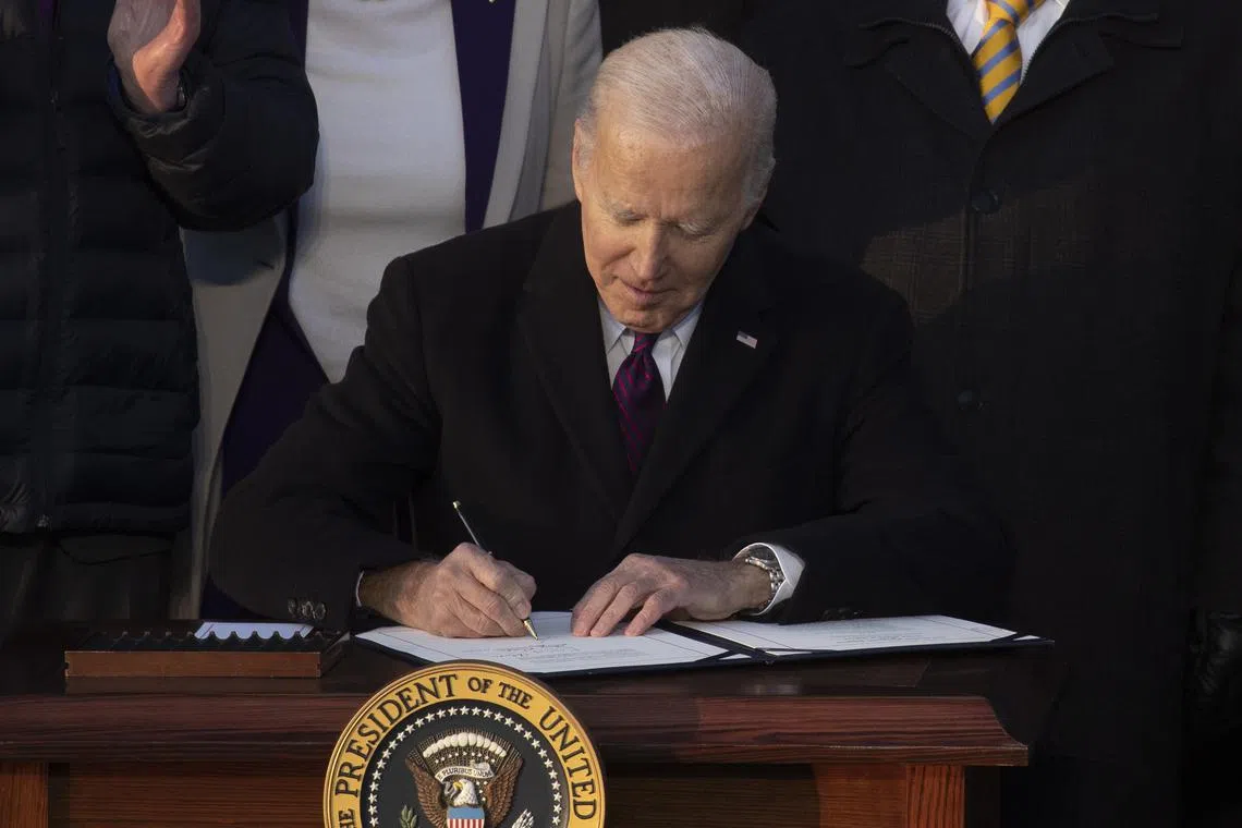 US President Joe Biden signing the Respect for Marriage Act on the South Lawn of the White House on Dec 13, 2022.