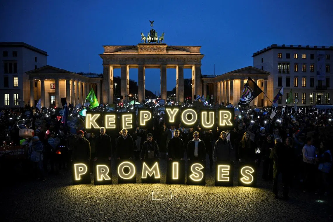 FILE PHOTO: Demonstrators attend the Fridays for Future protest '#JustTransitionNow' next to the Brandenburg Gate during the United Nations Climate Change Conference (COP 30) which takes place in Belem, Brazil, in Berlin, Germany, November 14, 2025. REUTERS/Annegret Hilse/File Photo