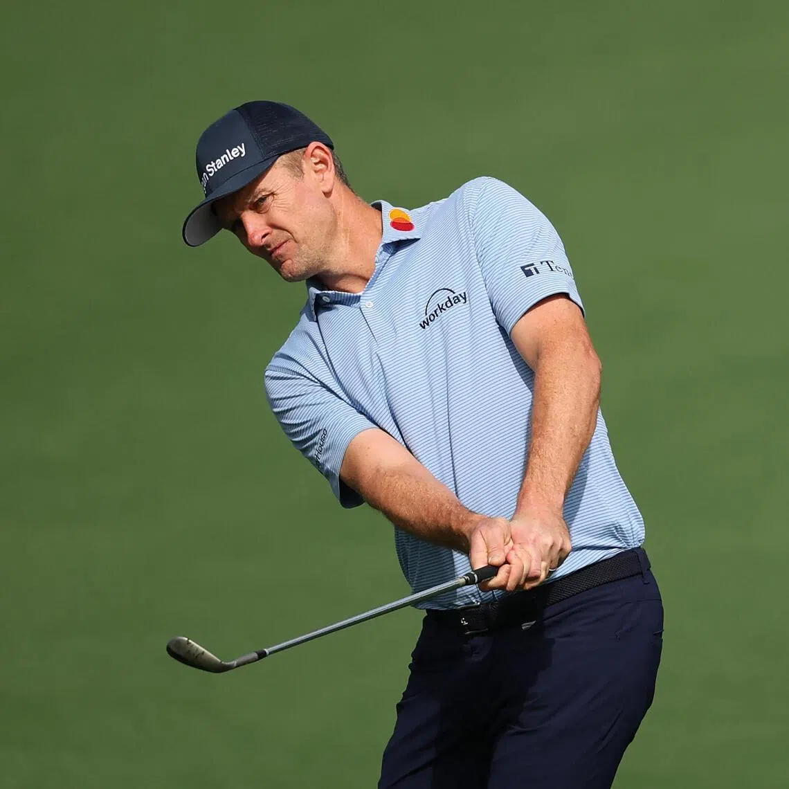 Justin Rose of England chipping onto the second hole green during a practice round before the 2026 Masters Tournament at Augusta National Golf Club on April 06, 2026, in Augusta, Georgia.