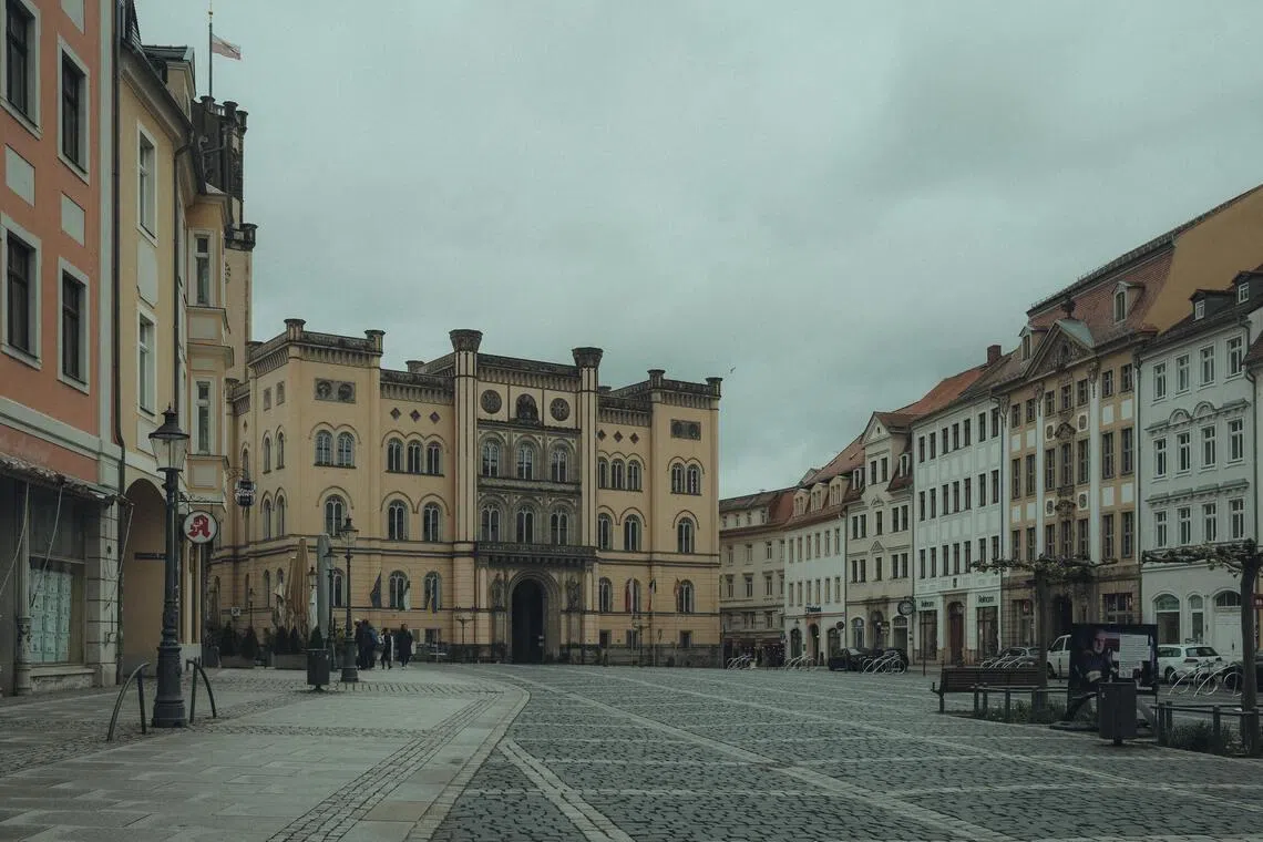 Two women, aged 25 and 26, and a 46-year-old man are presumed missing after the collapse of a historic apartment building in Goerlitz, a popular location for movie shoots.