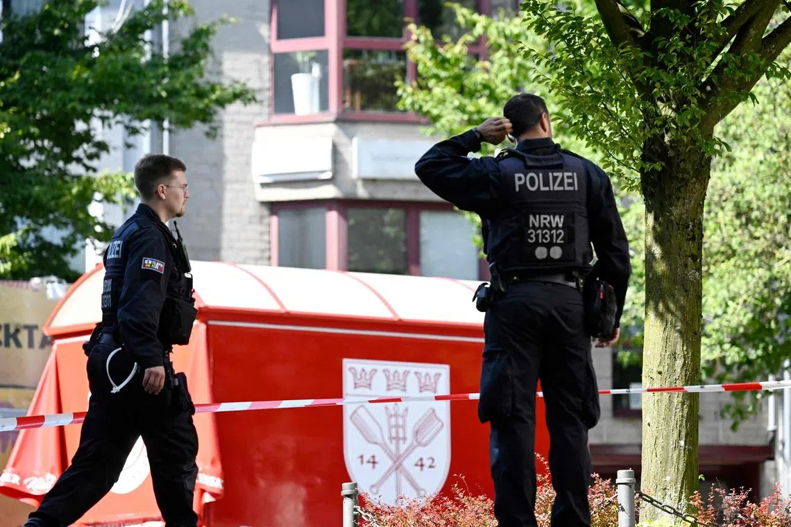 Police patrolling on Aug 24 near the scene where at least three people were killed and several injured when a man attacked them with a knife, in Solingen, Germany.