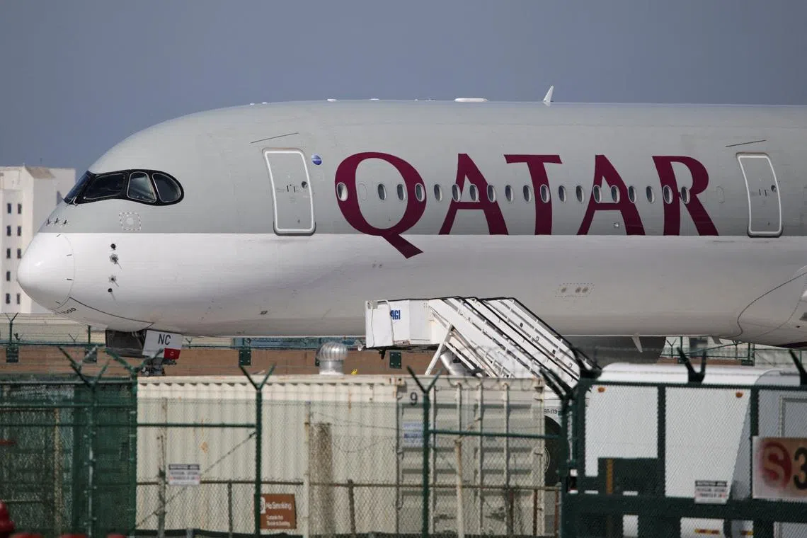 FILE PHOTO: A Qatar Airways plane sits on the tarmac at Los Angeles International Airport (LAX) in Los Angeles, California, U.S. March 3, 2026. REUTERS/Daniel Cole/File Photo