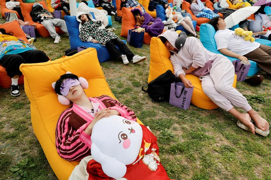 Participants sleep during the 2026 Power Nap contest at Han River park in Seoul on May 2.