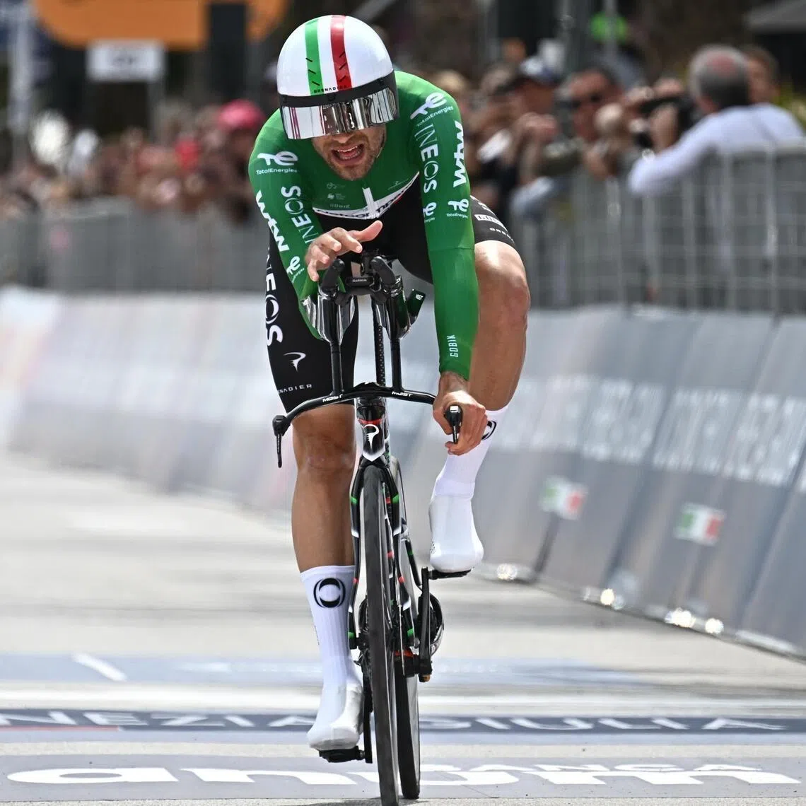 Italian cyclist Filippo Ganna of team Netcompany INEOS crosses the finish line of the 10th stage of the Giro d'Italia, an individual time trial (ITT) over 42 km from Viareggio to Massa, on May 19, 2026.