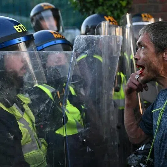A demonstrator reacting after kicking a police wall on June 2 near Portswood Police Station, following a protest march in Southampton, southern England.