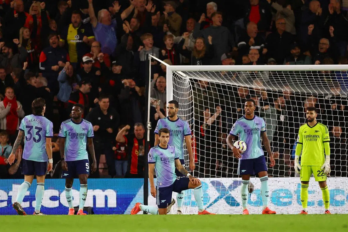 Arsenal players look dejected after AFC Bournemouth's Ryan Christie scores their first goal.