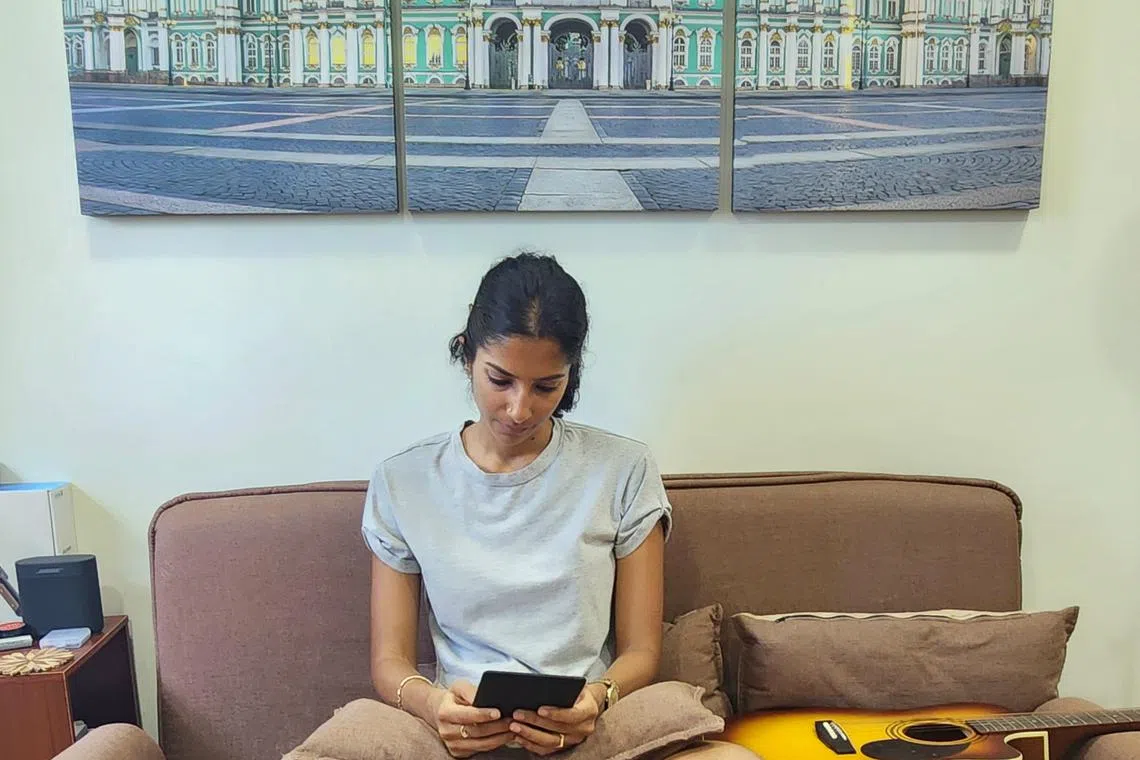 Musician Sushma Soma loves to read on her couch in her living room.