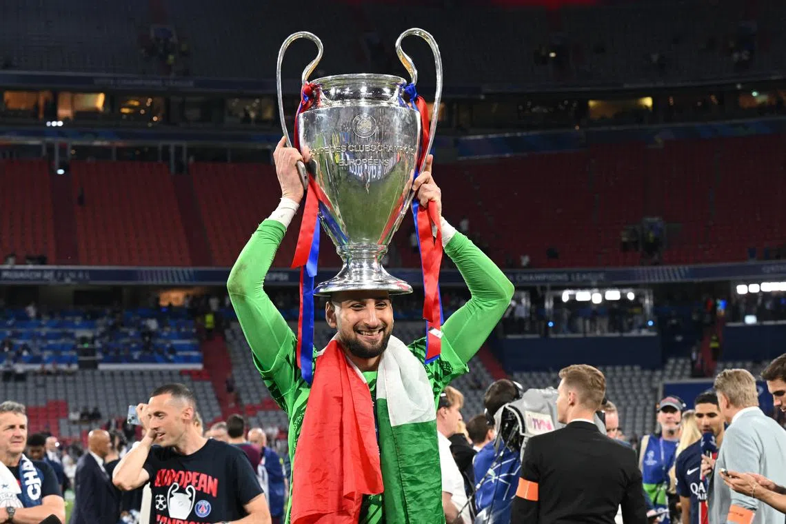 FILE PHOTO: Soccer Football - Champions League - Final - Paris St Germain v Inter Milan - Allianz Arena, Munich, Germany - May 31, 2025 Paris St Germain's Gianluigi Donnarumma celebrates with the trophy after winning the Champions League REUTERS/Angelika Warmuth/File Photo