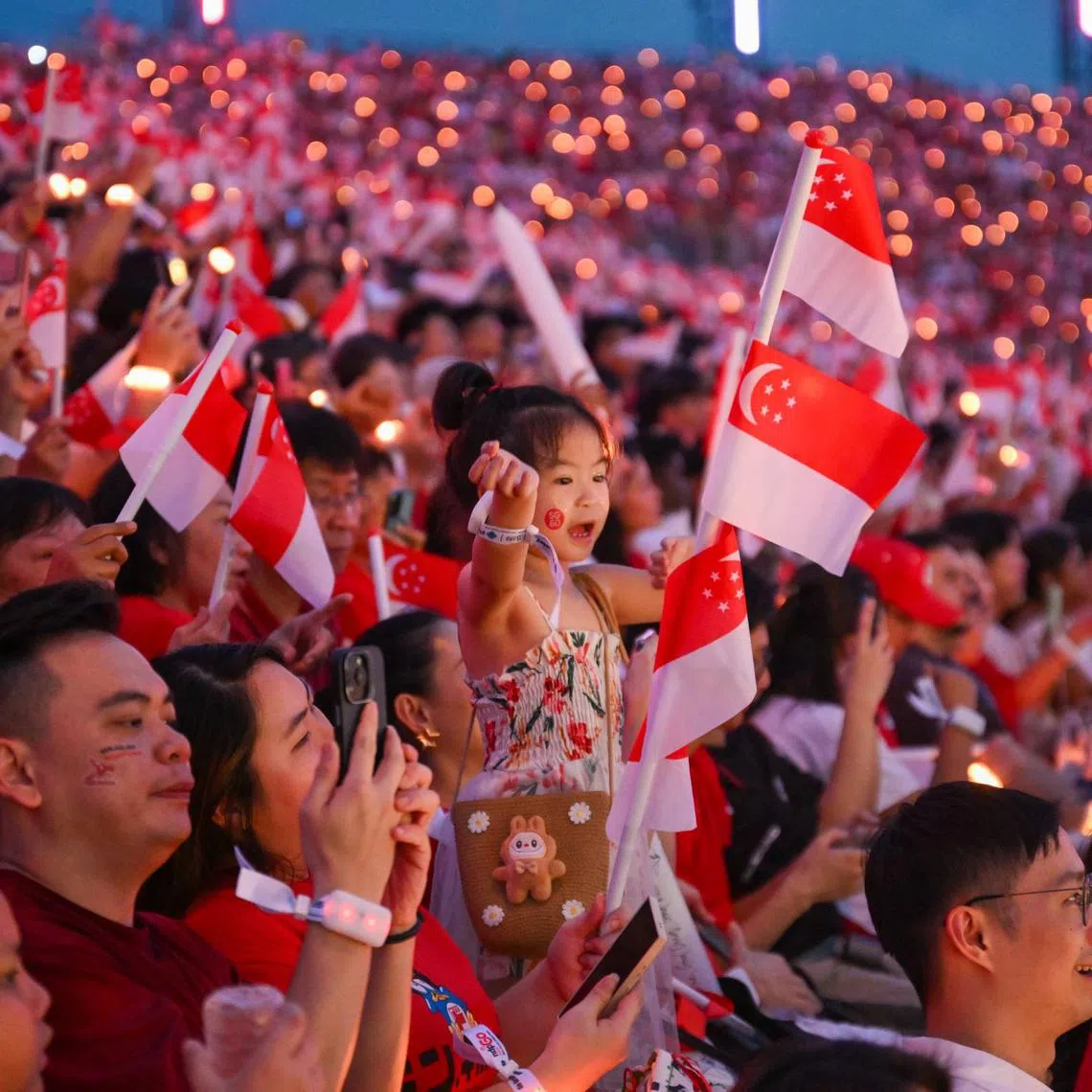 Spectators at the National Day Parade at the Padang on Aug 9.