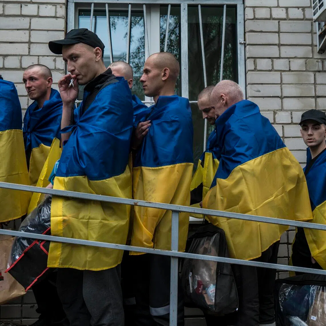 Ukrainian soldiers brought home by a prisoners of war exchange with Russia arrive in the Chernihiv region of Ukraine, May 6.