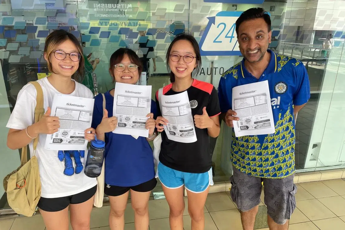 (From left) Ms Adrienne Chue, 19, Ms Jamie Ang, 19, Ms Elsa Tan, 19, and Mr Alex Gazza, 35 at Toa Payoh SingPost after obtaining Coldplay tickets.
