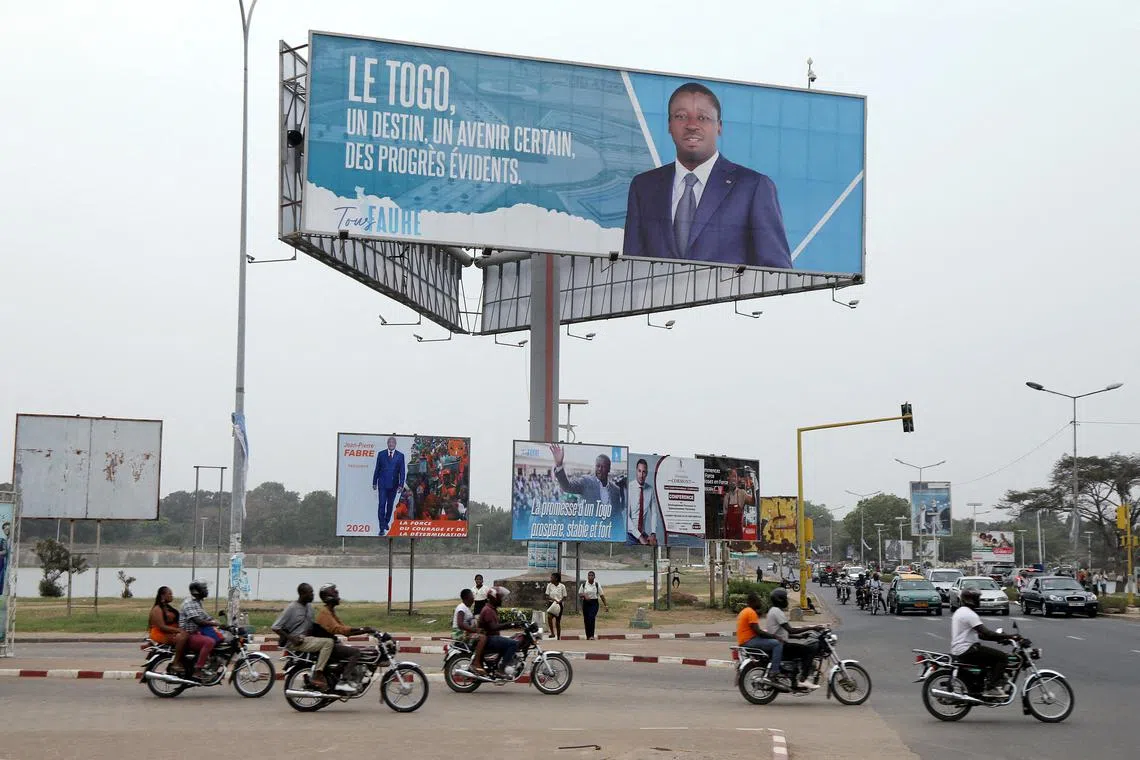 FILE PHOTO: A billboard of Faure Gnassingbe is pictured on a street in Lome, Togo, February 19, 2020. Picture taken February 19, 2020. REUTERS/Luc Gnago/File Photo