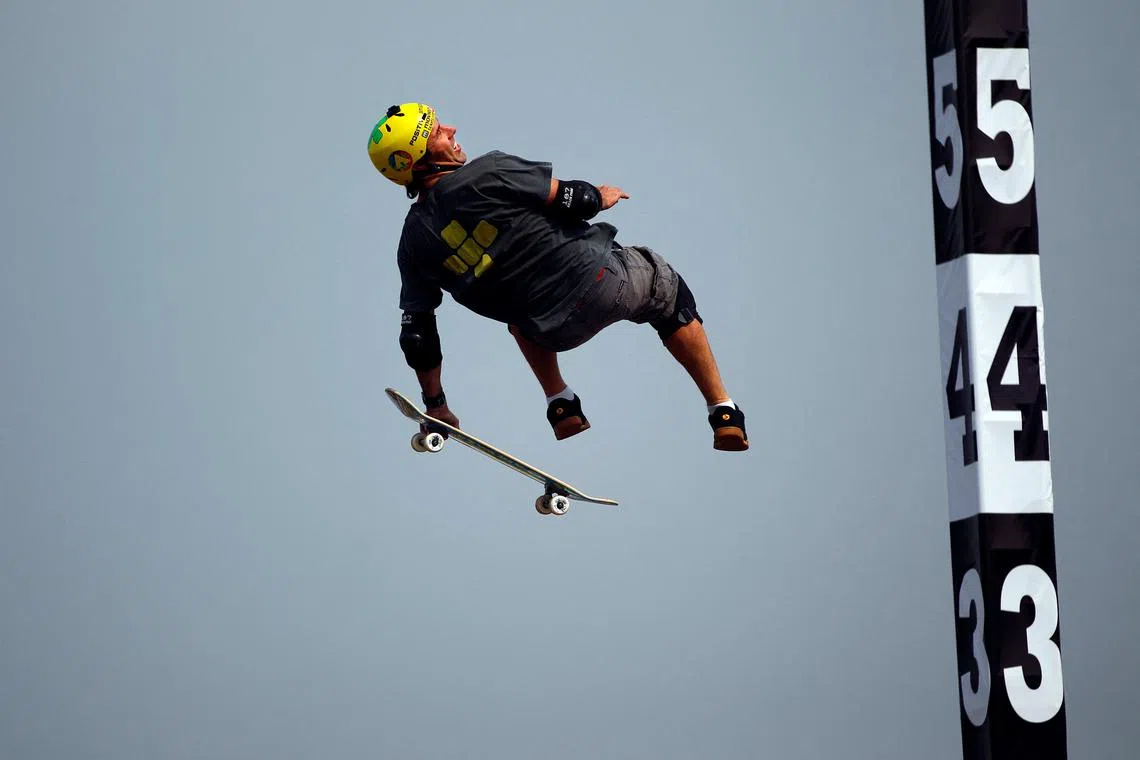 FILE PHOTO: Skateboarder Andy Macdonald performs at the SKB Mini-Mega final during the World Extreme Games in Shanghai May 2, 2014. REUTERS/Carlos Barria/File Photo