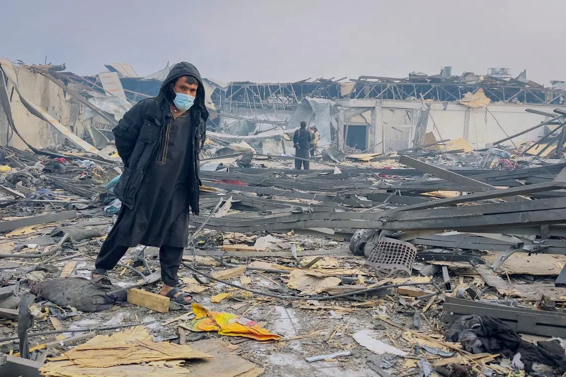 A man walks at the site of a drug users rehabilitation hospital destroyed in what the Taliban said was a Pakistani air strike in Kabul, Afghanistan, March 17, 2026. REUTERS/Sayed Hassib