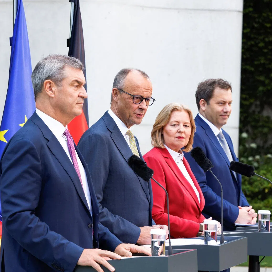 (From left) Bavarian State Premier Markus Soeder, German Chancellor Friedrich Merz, Labour and Social Affairs Minister Baerbel Bas and Finance Minister Lars Klingbeil in Berlin on July 2.
