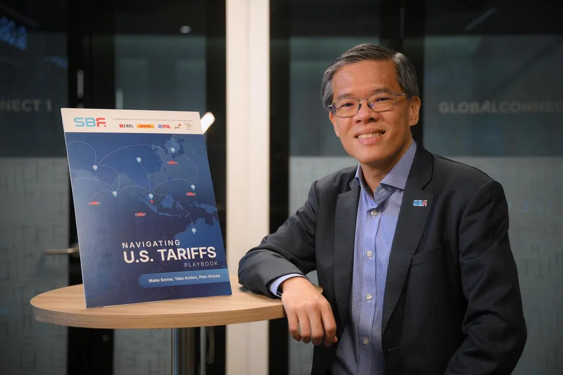 Singapore Business Federation (SBF) CEO Kok Ping Soon with a mock up of the tariff playbook for businesses, pictured on May 20, 2025.