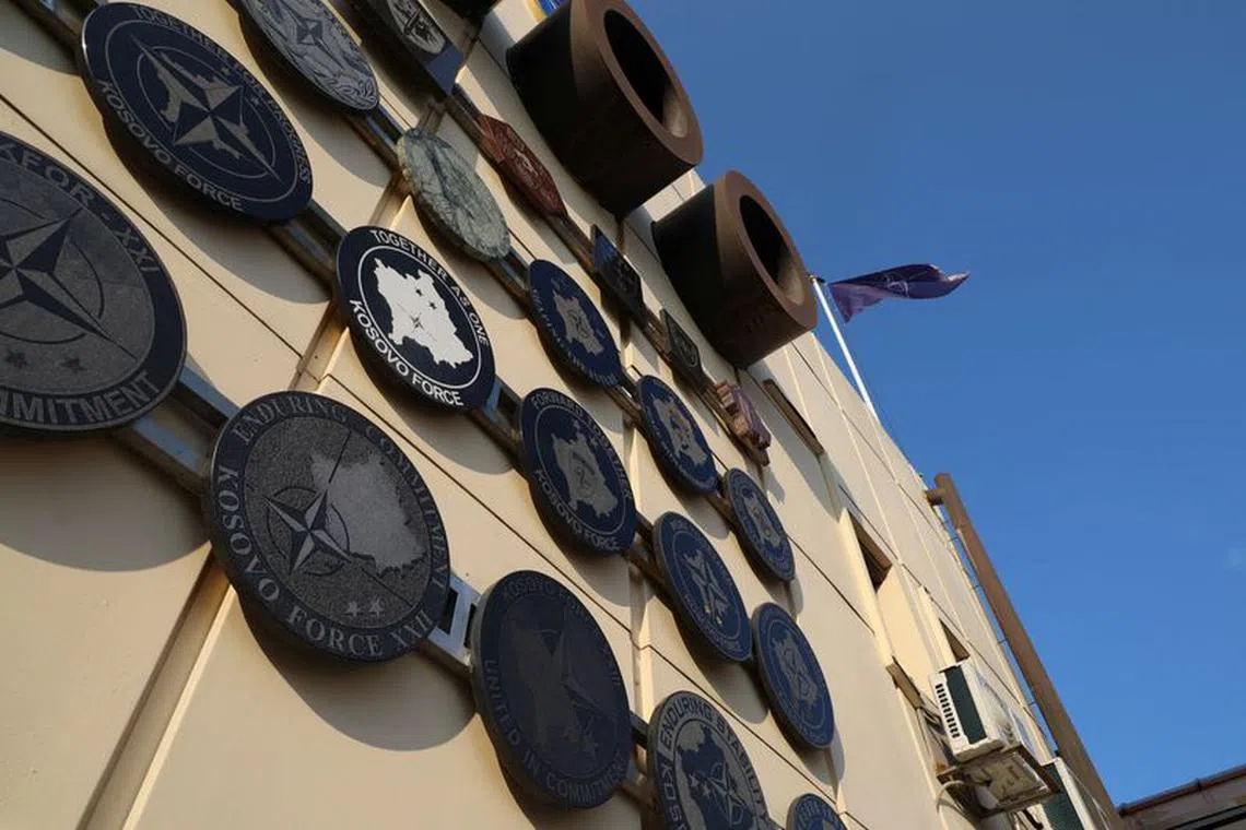 A NATO flag waves at the headquarters of the NATO Mission in Kosovo, June 20, 2023. REUTERS/Fatos Bytyci/File Photo