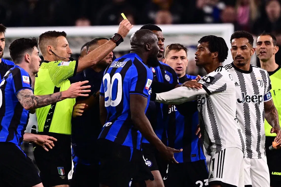 Inter's Romelu Lukaku arguing with Juventus’ Juan Cuadrado after he received a second yellow card in the Italian Cup semi-final first leg in Turin.