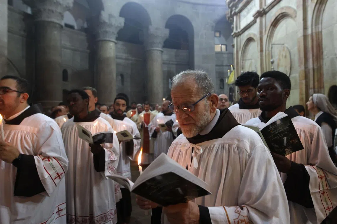 Churchgoers were ushered through the courtyard of the Church of the Holy Sepulchre in Jerusalem.