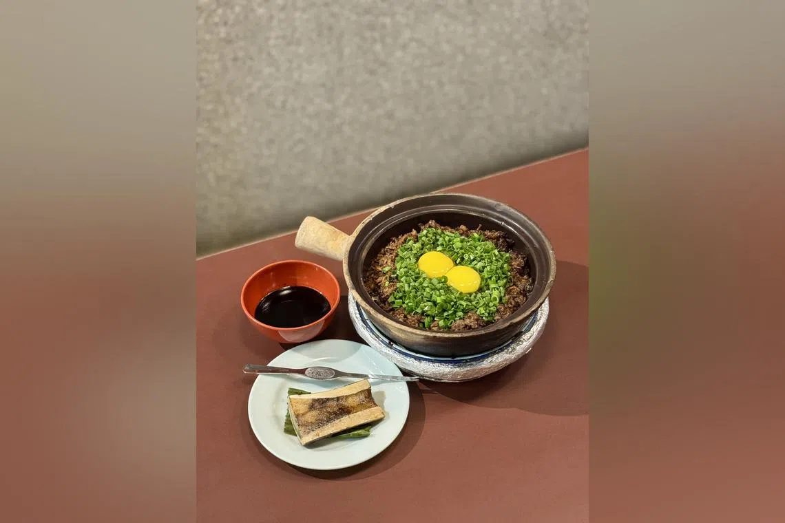 Beef bone marrow claypot rice from Geylang Claypot Rice.