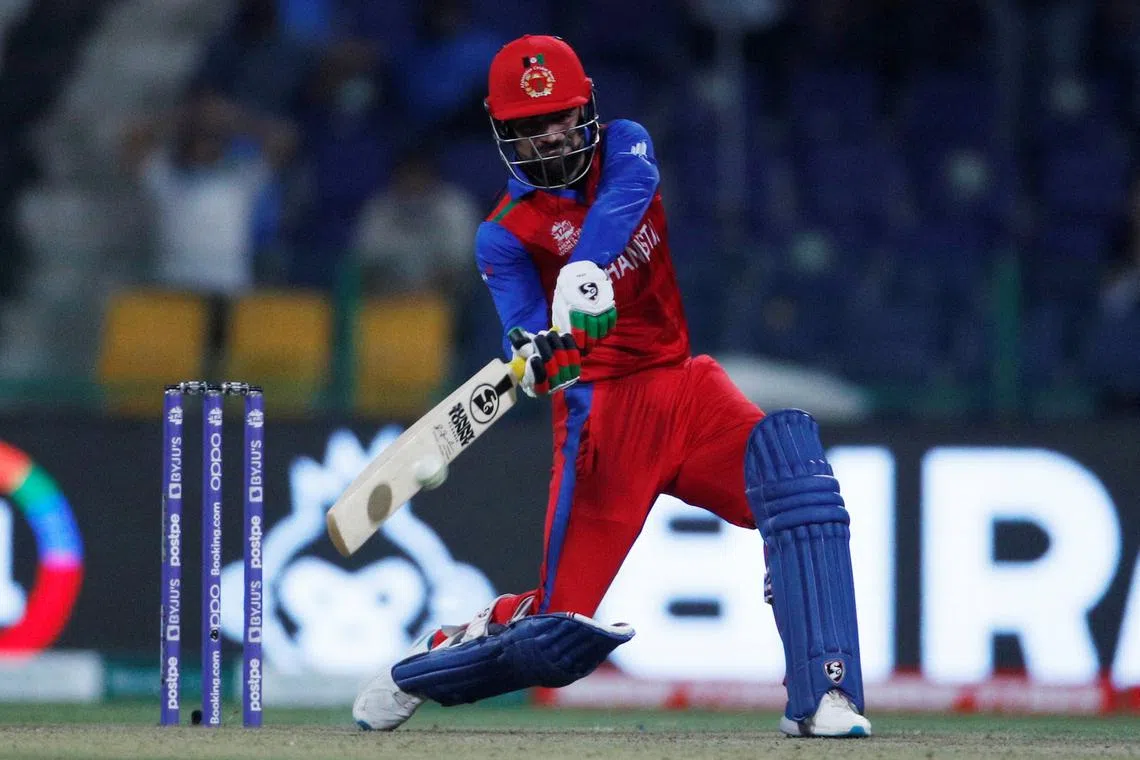 FILE PHOTO: Cricket - ICC Men's T20 World Cup - Super 12 - Group 2 - India v Afghanistan - Sheikh Zayed Cricket Stadium, Abu Dhabi, United Arab Emirates - November 3, 2021 Afghanistan's Rashid Khan in action REUTERS/Hamad I Mohammed/File Photo
