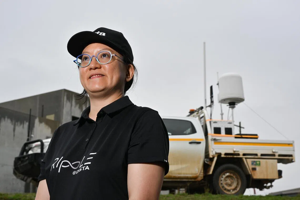 DSTA’s technology development director Ho Cheeng Tse in front of a counter-unmanned aerial system on Oct 23.
