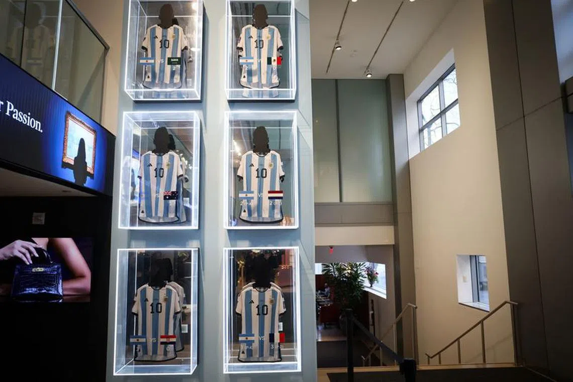 Six match shirts worn by Argentina's Lionel Messi during the 2022 FIFA World Cup in Qatar, are displayed during a press preview ahead of their auction at Sotheby's in New York City, U.S., November 30, 2023. REUTERS/Mike Segar/File photo