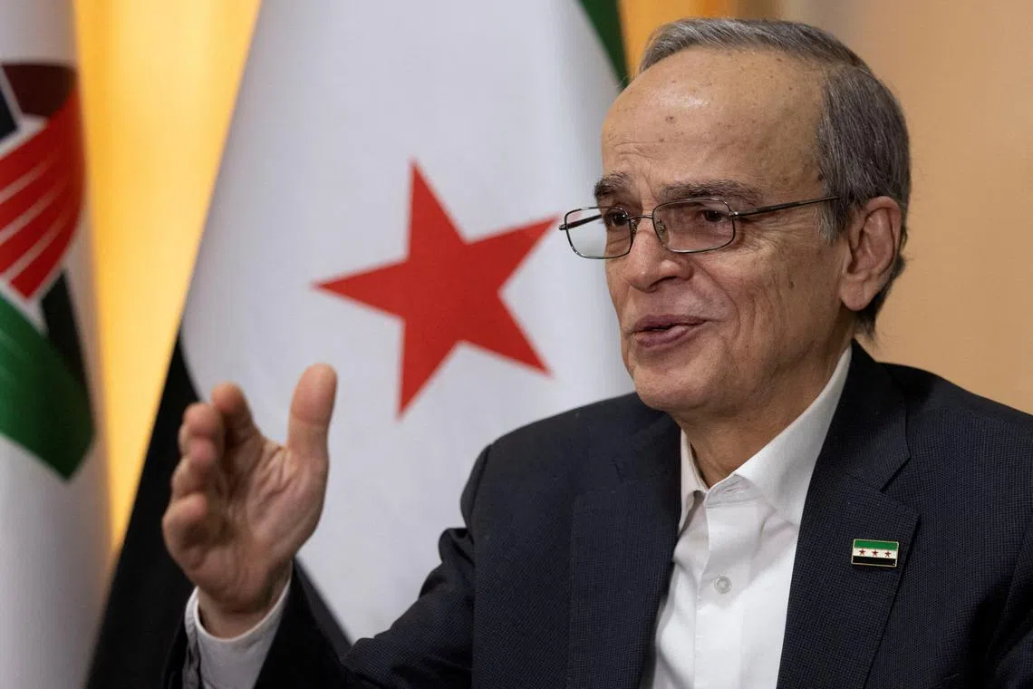 FILE PHOTO: Hadi Al Bahra, president of the National Coalition of Syrian Revolution and Opposition Forces, speaks during an interview with Reuters in Istanbul, Turkey, December 2, 2024. REUTERS/Umit Bektas/File Photo