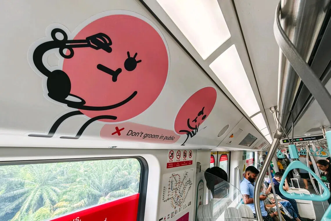 Sticker decals on MRT trains reminding commuters not to perform personal grooming in public, including clipping of toenails.