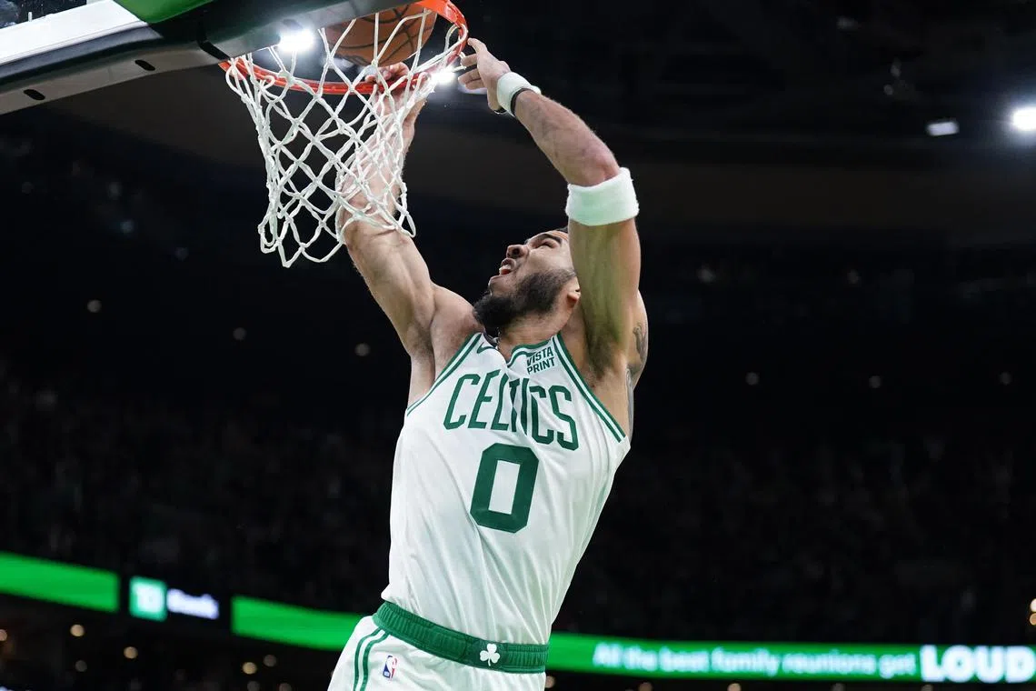 Boston Celtics forward Jayson Tatum dunks in the last seconds of play against the Chicago Bulls in the second half at TD Garden.