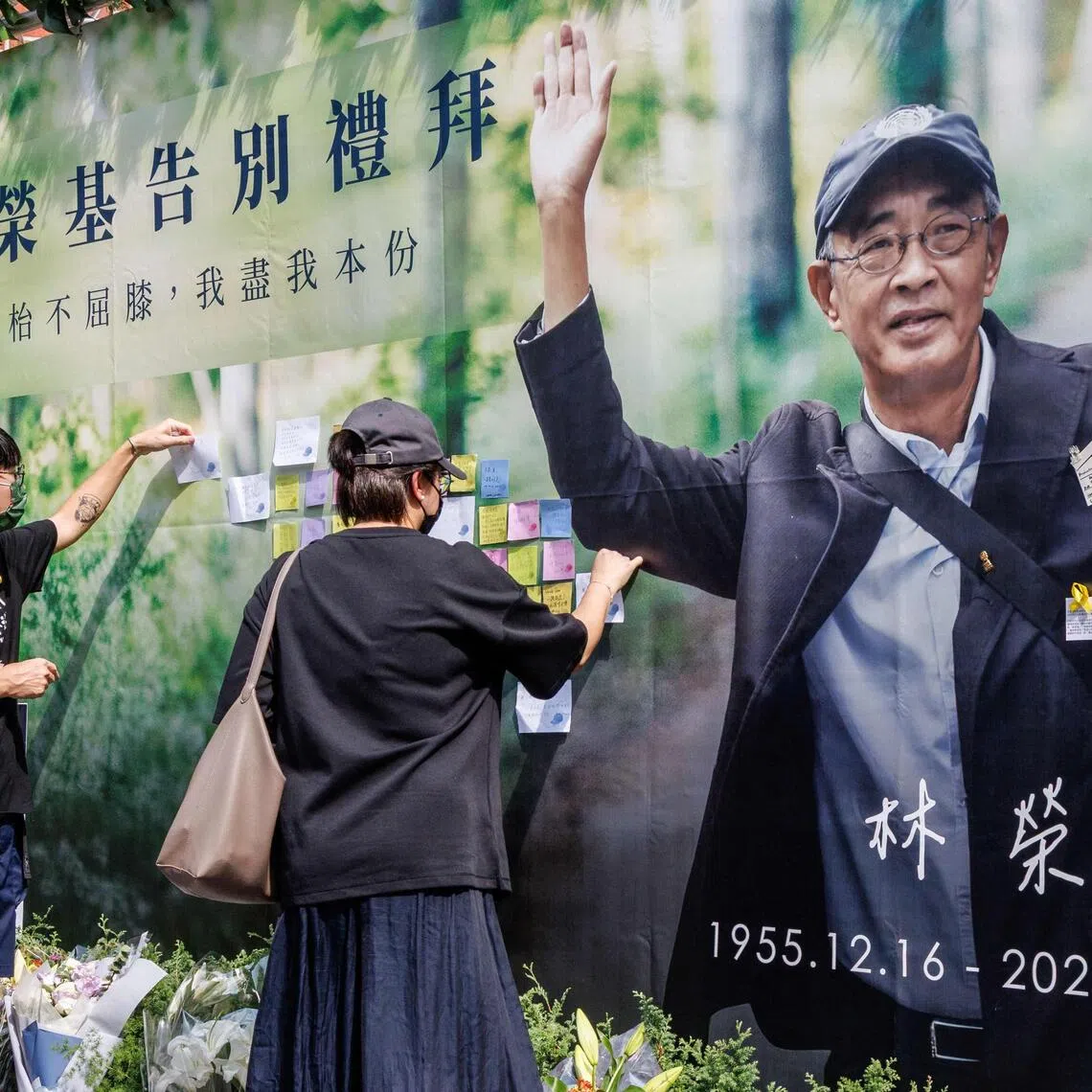 Mourners leave messages on a wall during the funeral of Hong Kong bookseller Lam Wing-kee in Taipei on July 31.