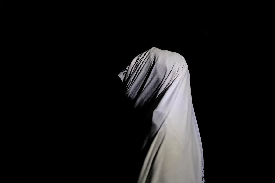 FILE PHOTO: A Nigerian woman, unnamed to protect her identity, who told Reuters she received an abortion under a secret program run by the Nigerian military, poses for a portrait in an undisclosed location in Nigeria, September 28, 2020.  REUTERS/Paul Carsten/File Photo