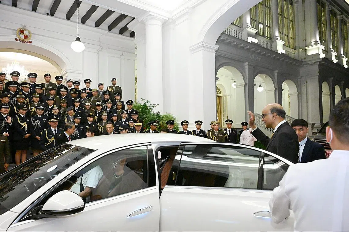 President Tharman Shanmugaratnam bidding the full-time and honorary aides-de-camp (ADCs) goodbye after the ADC Appointment Ceremony and Appreciation Dinner on May 27 at the Istana.