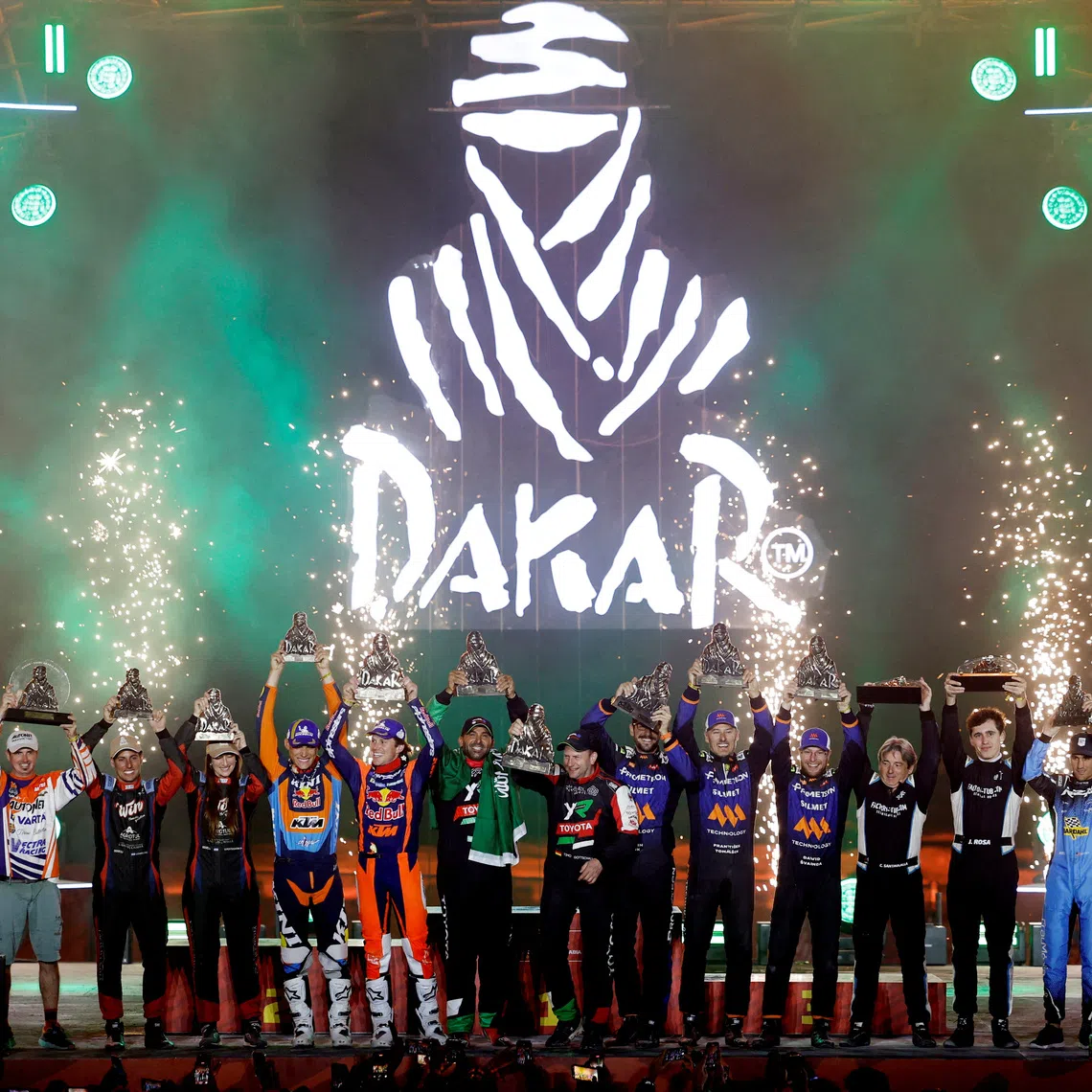 FILE PHOTO: Rallying - Dakar Rally - Shubaytah, Saudi Arabia - January 17, 2025 General view as all of the 2025 Dakar Rally winners celebrate with their trophies on the podium REUTERS/Hamad I Mohammed/File Photo