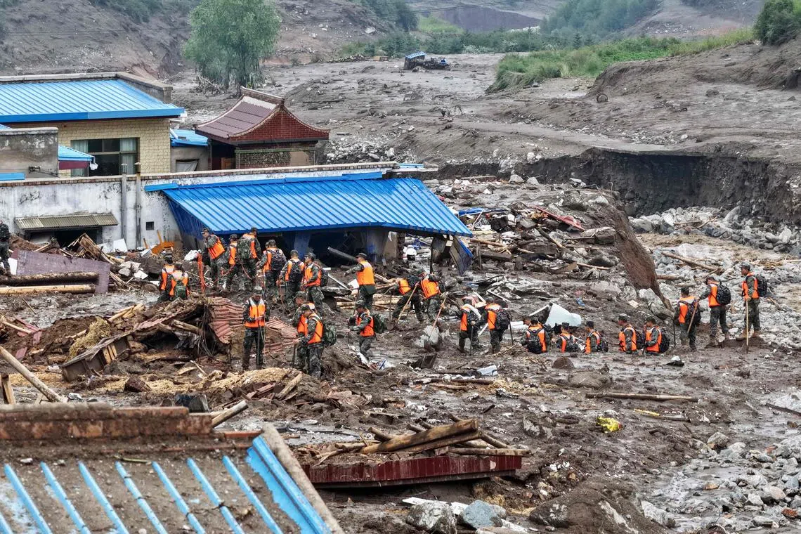 Rescue workers search for survivors after a flash flood in Yuzhong county, in China’s north-west Gansu province on Aug 8, 2025. 