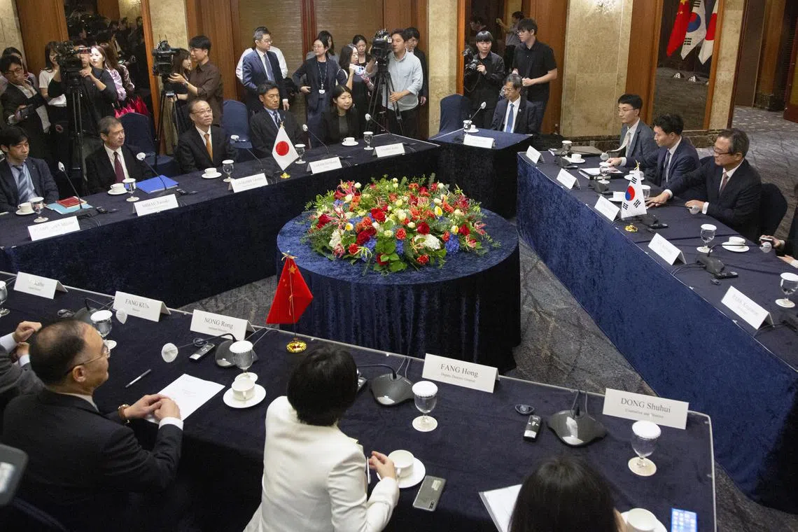 epa10883241 Japanese Senior Deputy Foreign Minister Takehiro Funakoshi (C, left table), South Korean Deputy Foreign Minister Chung Byung-won (R) and Chinese Assistant Foreign Minister Nong Rong (C, foreground table) hold a a high-level meeting in Seoul, 26 September 2023, to discuss a three-way cooperation and explore the possibility of resuming the long-stalled summit of their leaders.  EPA-EFE/JEON HEON-KYUN