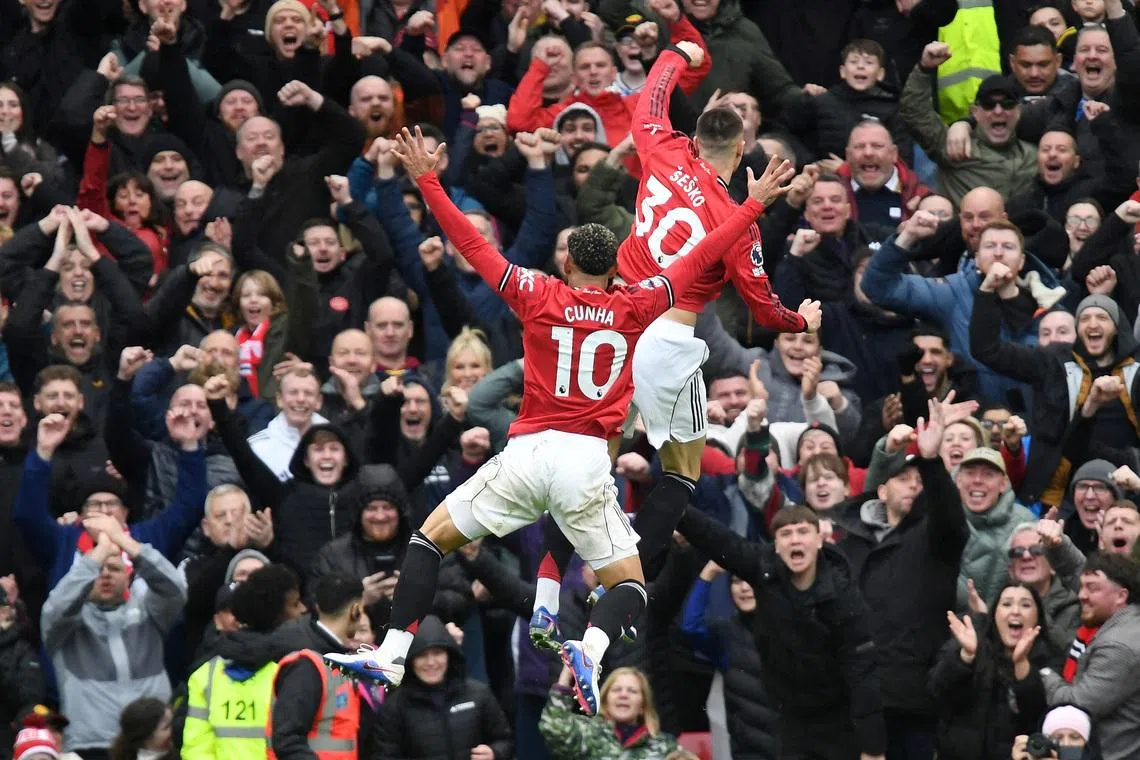 Soccer Football - Premier League - Manchester United v Aston Villa - Old Trafford, Manchester, Britain - March 15, 2026 Manchester United's Benjamin Sesko celebrates scoring their third goal with Matheus Cunha REUTERS/Peter Powell