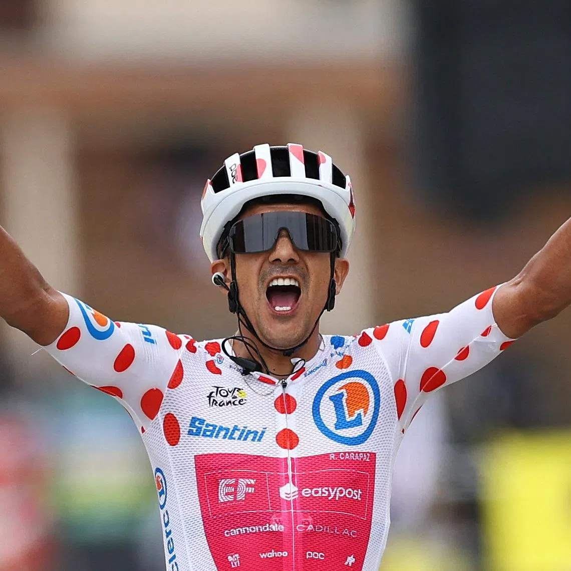EF Education-EasyPost’s Richard Carapaz wearing the polka dot jersey celebrates winning Stage 20 of the Tour de France on July 25.