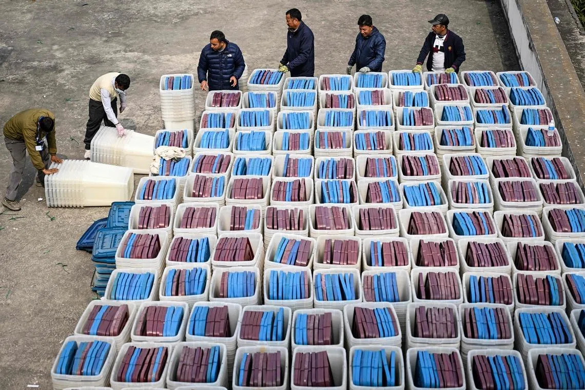 Election officials inspecting ballot boxes before they are dispatched from the Election Commission office in Kathmandu on Feb 9, 2026 ahead of Nepal's general elections. 