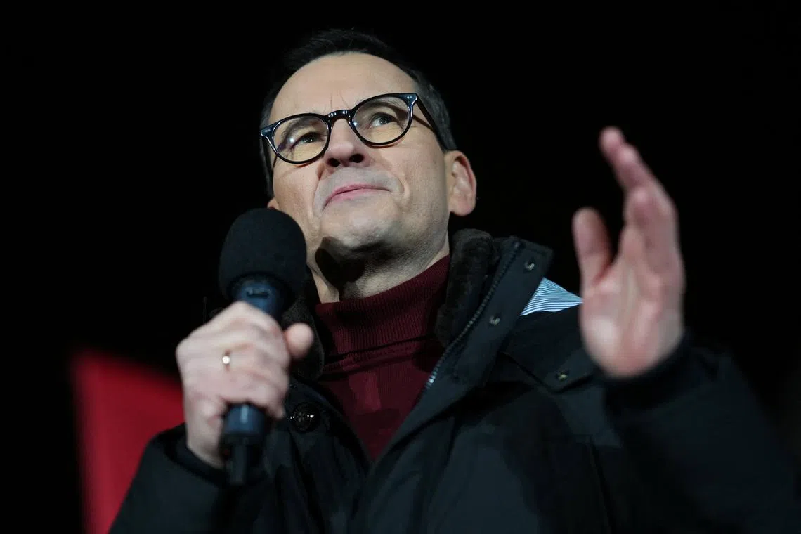 Former Polish Prime Minister and Law and Justice Party MP Mateusz Morawiecki speaks as supporters of the Law and Justice (PiS) party gather in protest against state media overhaul and arrest of former interior minister and his deputy in Warsaw, January 11, 2024. REUTERS/Aleksandra Szmigiel/File Photo