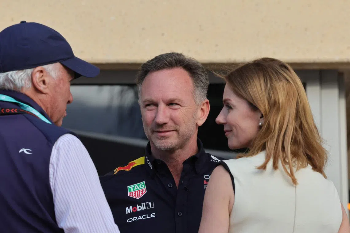 Red Bull team principal Christian Horner and his wife British singer Geri Halliwell talk to an acquaintance ahead of the Bahrain Grand Prix.