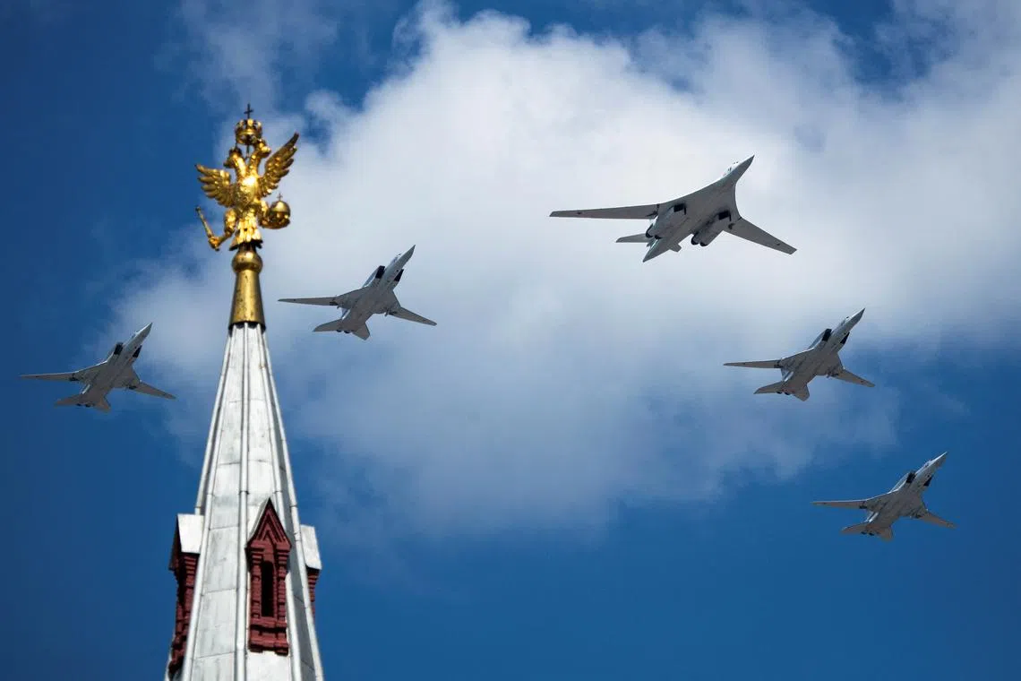 FILE PHOTO: A Russian Tu-160 and Tu-22M3 aircraft fly over Red Square during the Victory Day Parade in Moscow, Russia, June 24, 2020. The military parade, marking the 75th anniversary of the victory over Nazi Germany in World War Two, was scheduled for May 9 but postponed due to the outbreak of the coronavirus disease (COVID-19). Pavel Golovkin/Pool via REUTERS/File Photo