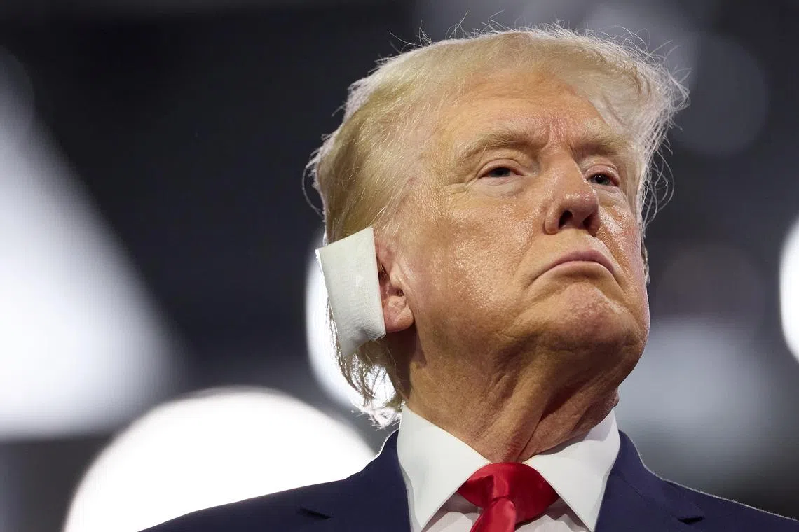 Former US president Donald Trump listens to speeches on the opening day of the Republican National Convention, in Milwaukee, Wisconsin.