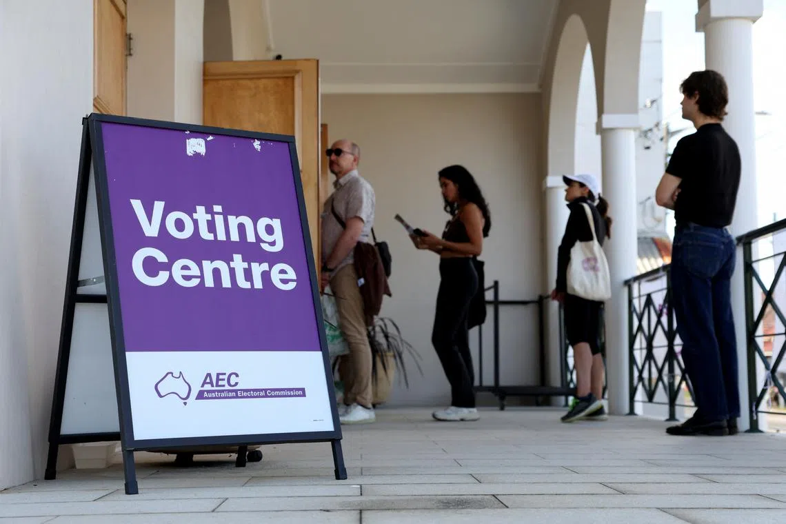 People queue outside a voting centre during the Australian federal election, in Sydney, Australia, May 3, 2025. REUTERS/Hollie Adams