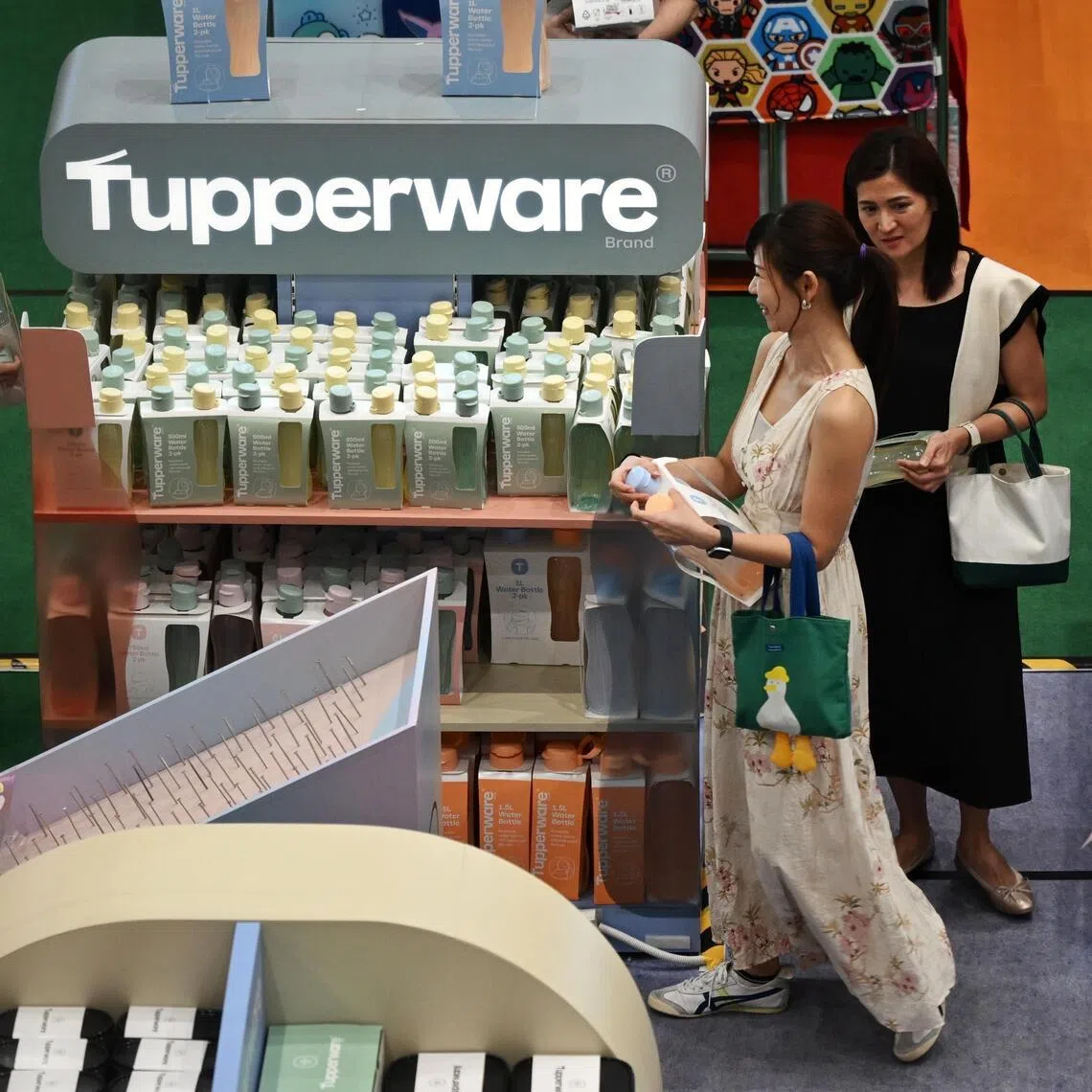 Shoppers looking at products set up at a Tupperware booth in Takashimaya's atrium, on Jan 5, 2026.