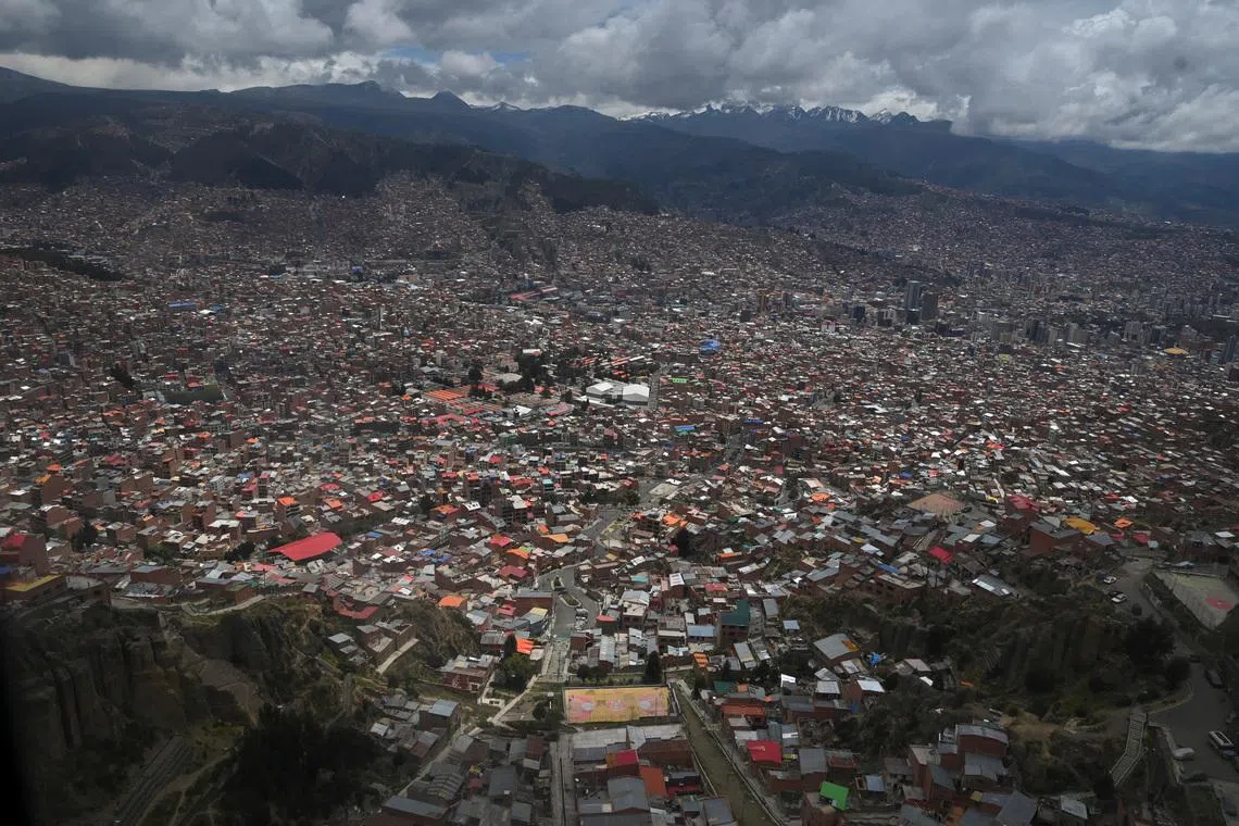 A view, taken through a window, shows the city of La Paz as the government discusses stabilizing the energy sector amid declining production and economic pressures, in El Alto, Bolivia, January 15, 2026. REUTERS/Claudia Morales/File Photo