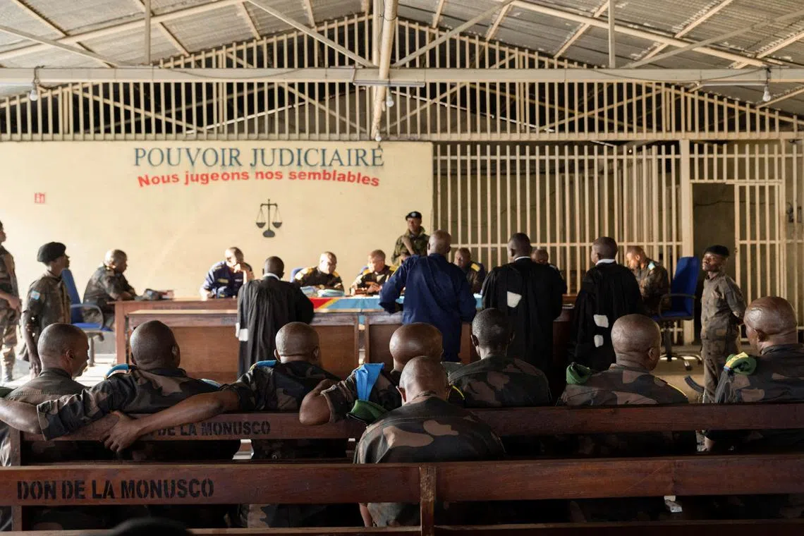 FILE PHOTO: Members of the Congolese army sentenced to death for desertion and cowardice when fighting M23 rebels sit inside a military courtroom during their trial in Goma, North Kivu province, Democratic Republic of Congo, May 3, 2024. REUTERS/Arlette Bashizi/File Photo