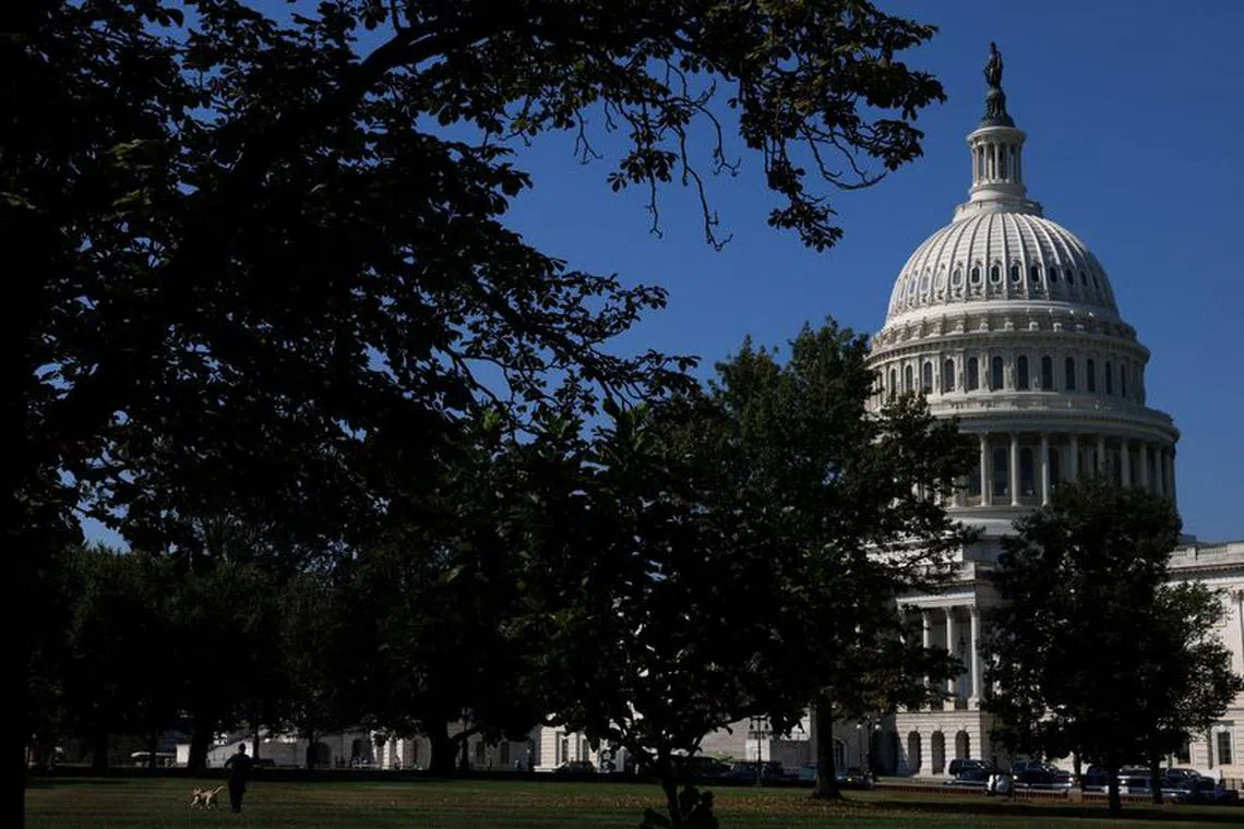 A U.S. Capitol Police Officer walks a K-9 dog in front of the Capitol amid talks over government funding, as the threat of an October government shutdown looms on Capitol Hill in Washington, U.S., September 6, 2023. REUTERS/Julia Nikhinson/File photo