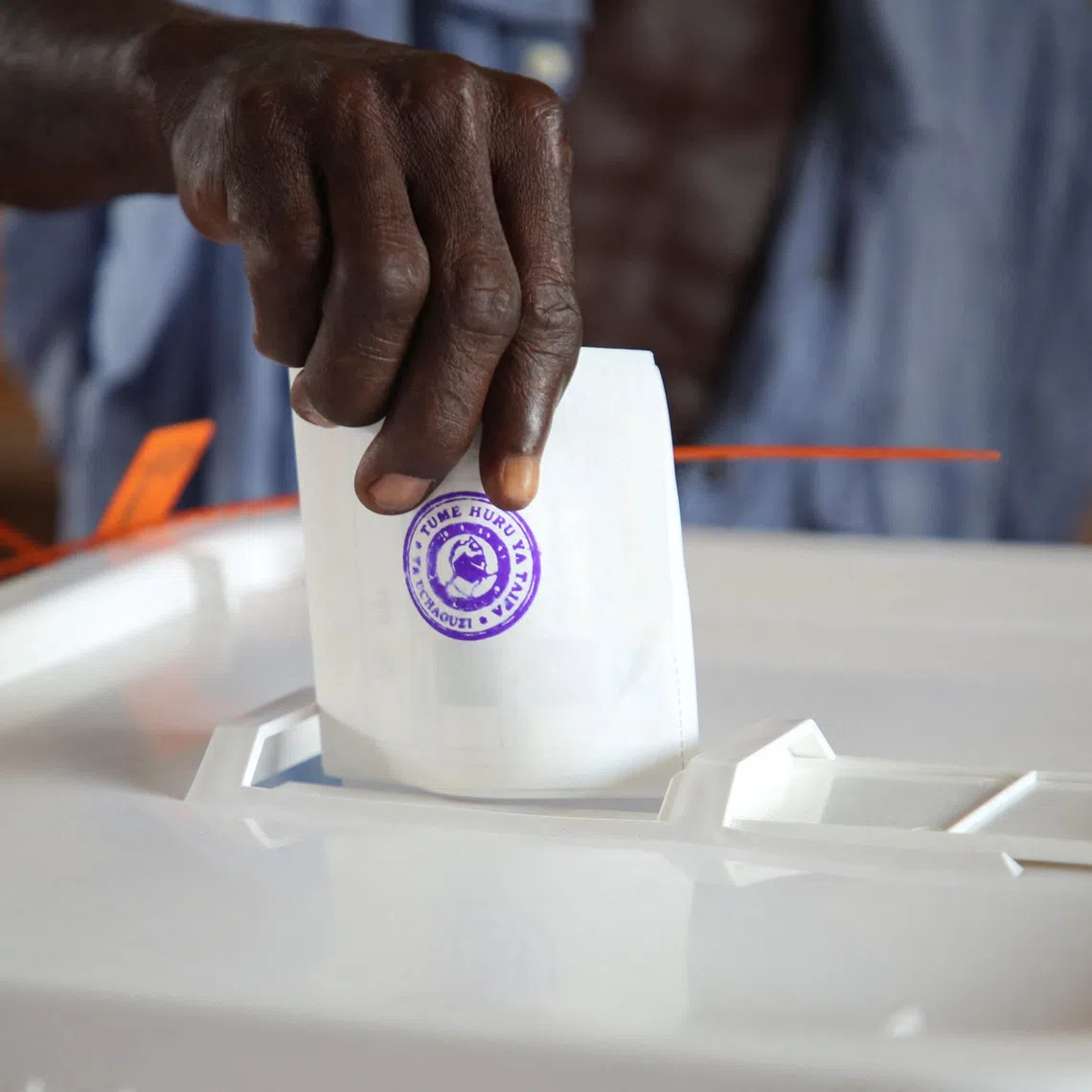 A man casts his vote during the general election at a polling station in Dar es Salaam, Tanzania, October 29, 2025. REUTERS/Emmanuel Herman